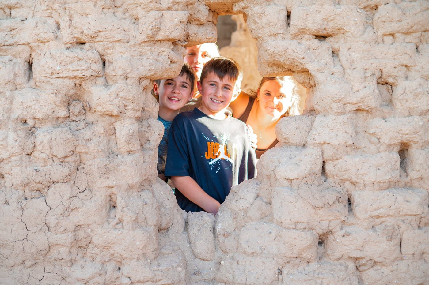 Campers making adobe bricks