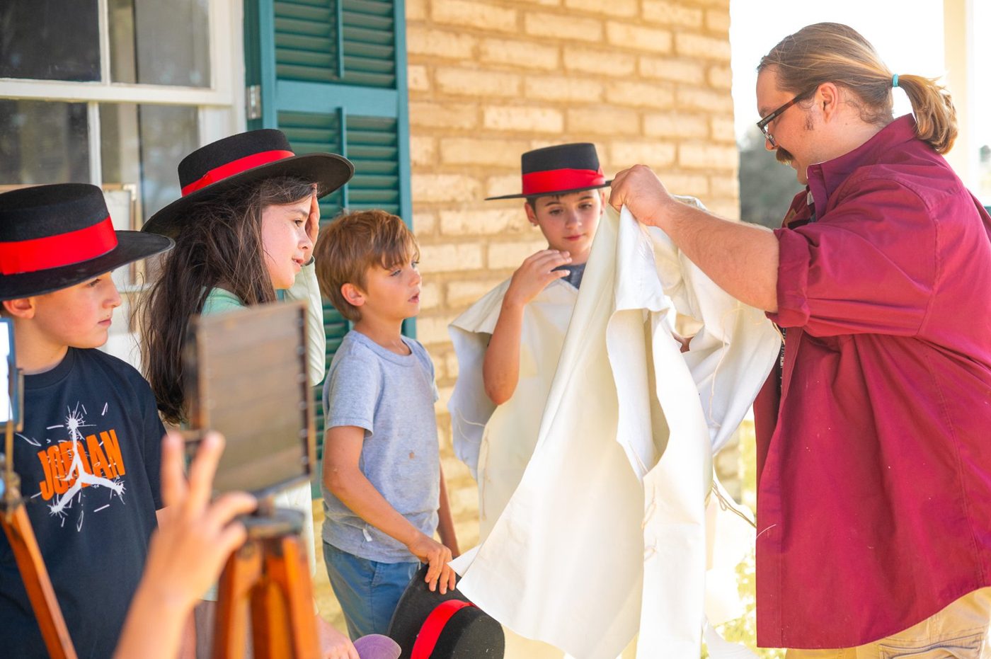 Campers in period dress at Fort Lowell