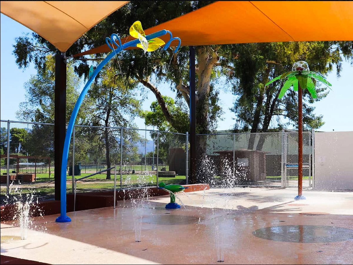 The shaded splash pad at Fort Lowell Park with water jets
